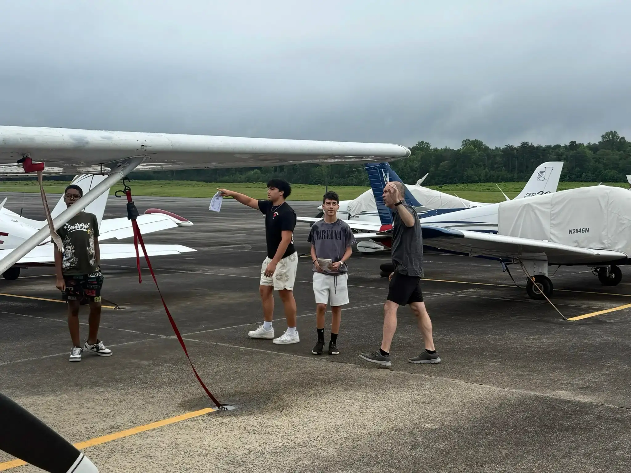 Solid Ground Aviation flight instructor teaching a student at the simulator controls in Fort Meade, MD