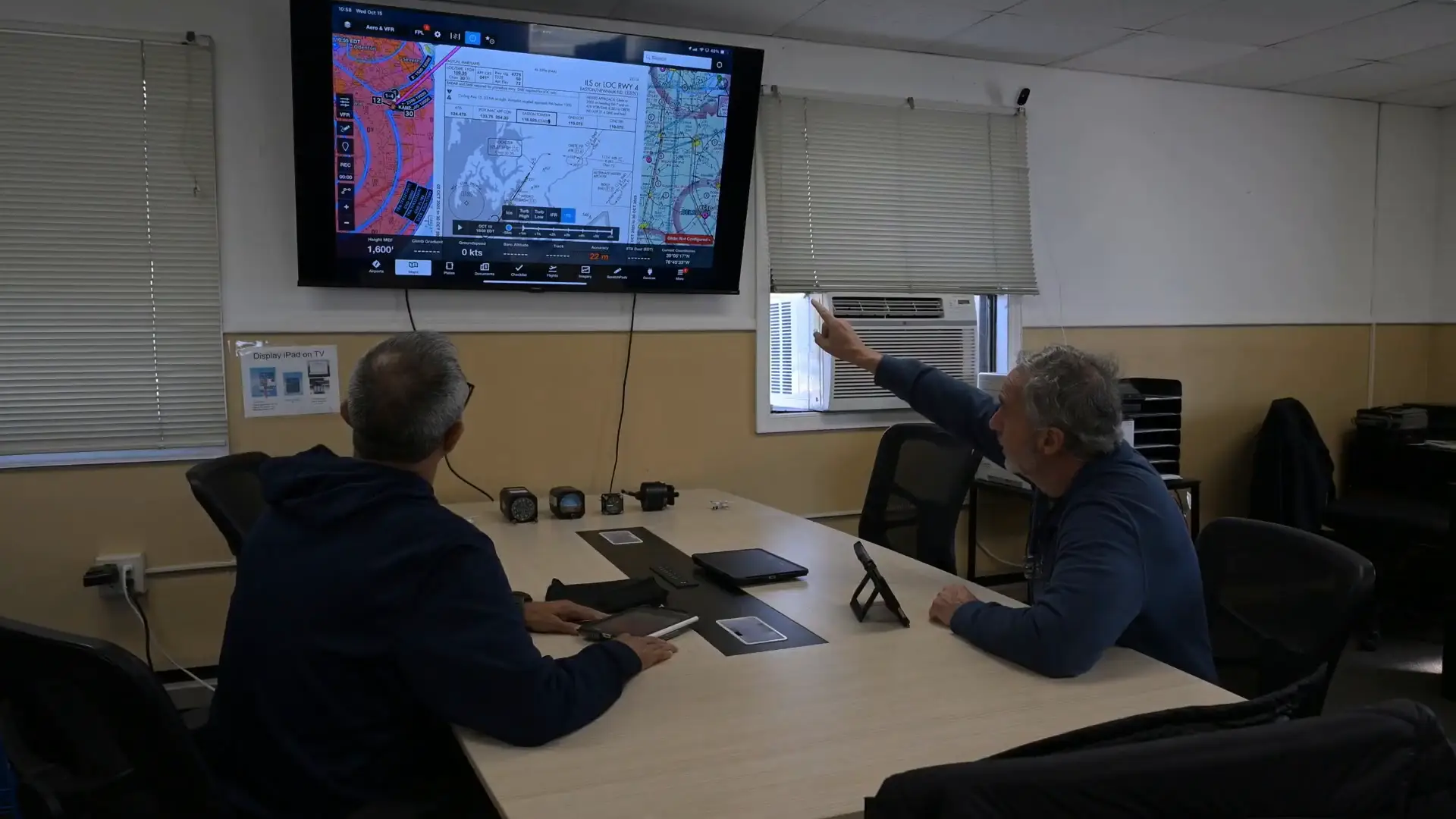 Instructor explaining a map and weather briefing to students at Solid Ground Aviation in Fort Meade, MD