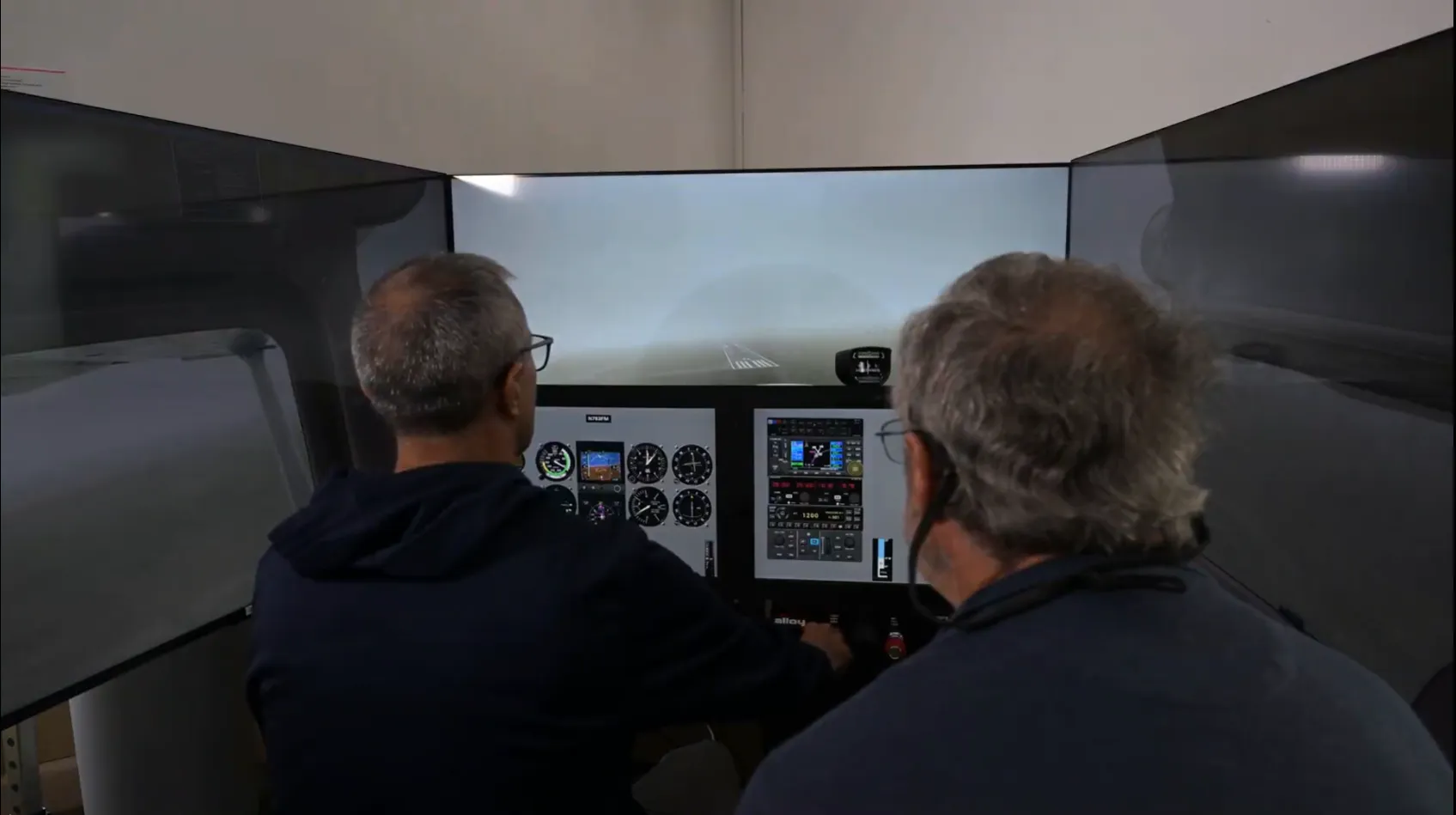 Instructor and student practicing a low-visibility landing in the simulator