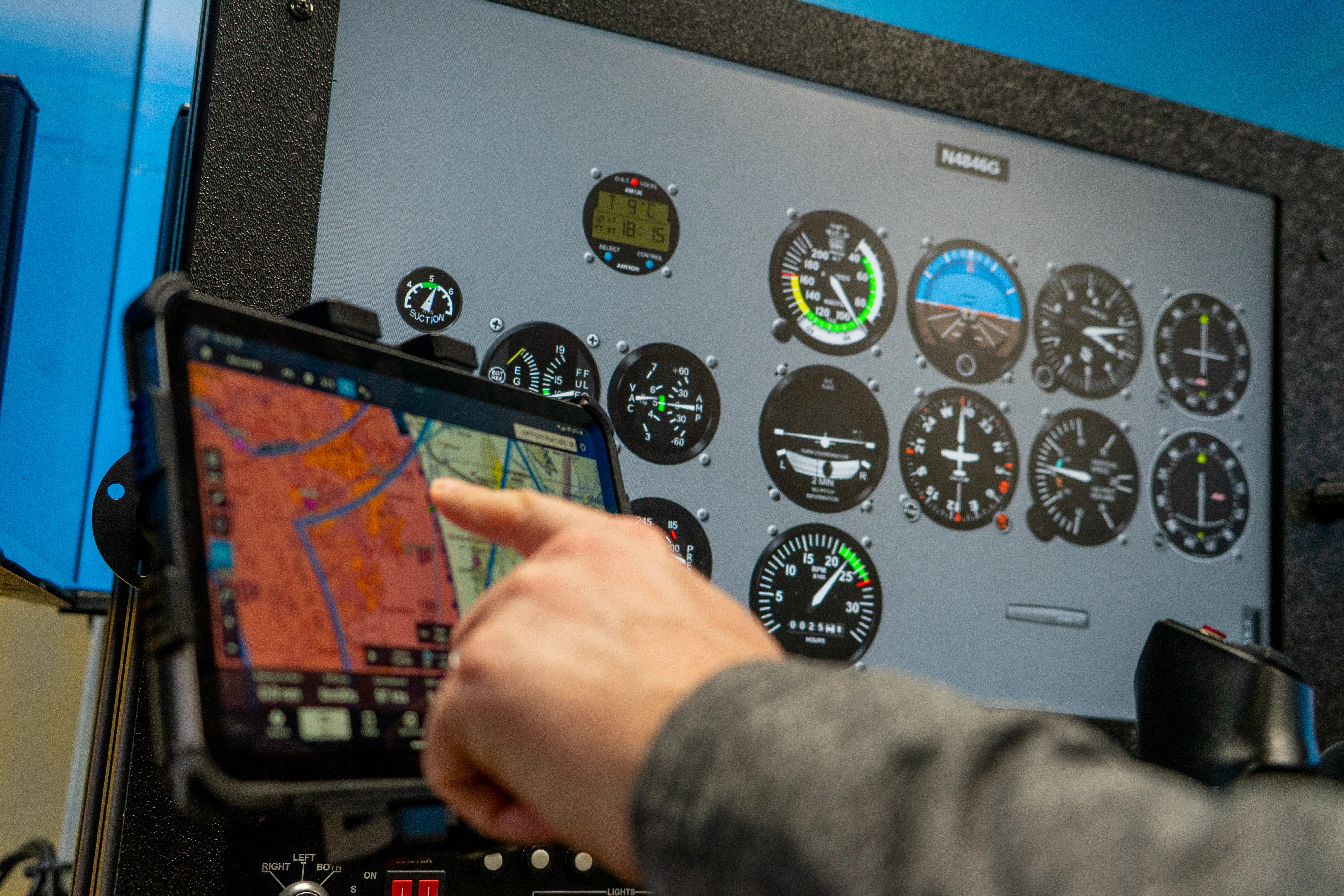 Solid Ground Aviation Fort Meade MD - Student hand maneuvering simulator map screen