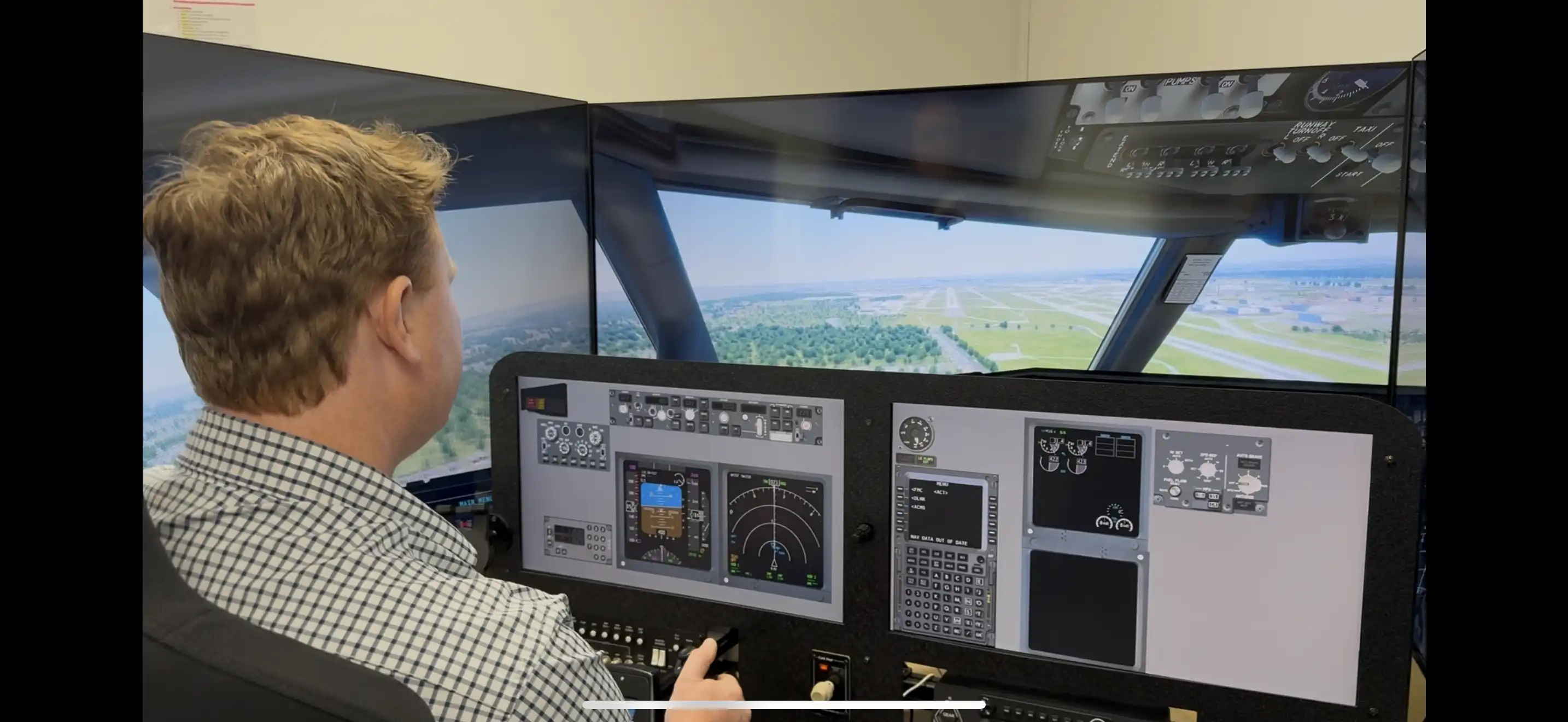 Student practicing procedures in the Solid Ground Aviation simulator