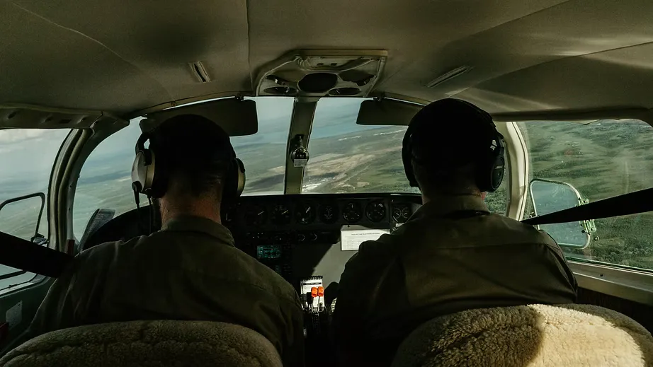 Two pilots in a cockpit during instrument training
