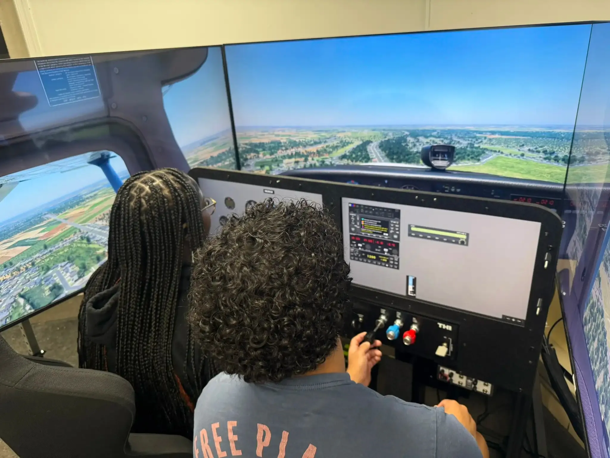 Youth aviation students practicing instrument scan in AATD sim at Solid Ground Aviation Fort Meade